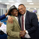 /media/orig/Elder-Thierry-K.-Mutombo,-president-de-linterregion-dAfrique-centrale-de-lEglise-de-Jesus-Christ-des-Saints-des-Derniers-Jours-(a-droite),-embrasse-le-Dr-Charles-Mulli,-fondateur-et-PDG-de-Mully.png